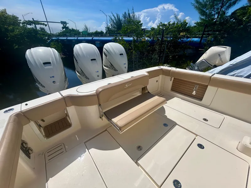 Slide: The Image of The image shows the stern of a Scout 380 boat with four outboard engines. - 5