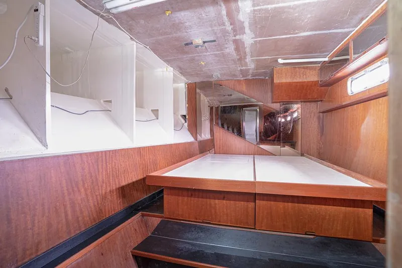 Slide: The Image of Interior of 2025 Catamaran Bloomfield 86 Motorsailor with wooden finishes and storage spaces. - 44