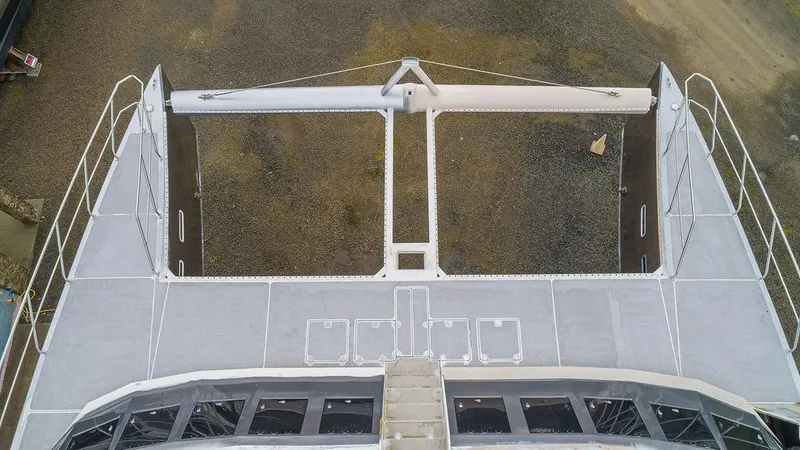 Slide: The Image of 2025 Catamaran Bloomfield 86 Motorsailor deck view, showcasing spacious design and modern features. - 23