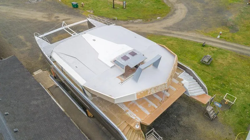 Slide: The Image of Aerial view of a 2025 Catamaran Bloomfield 86 Motorsailor under construction on land. - 10