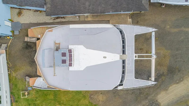 Slide: The Image of Aerial view of 2025 Catamaran Bloomfield 86 Motorsailor docked on land. - 12