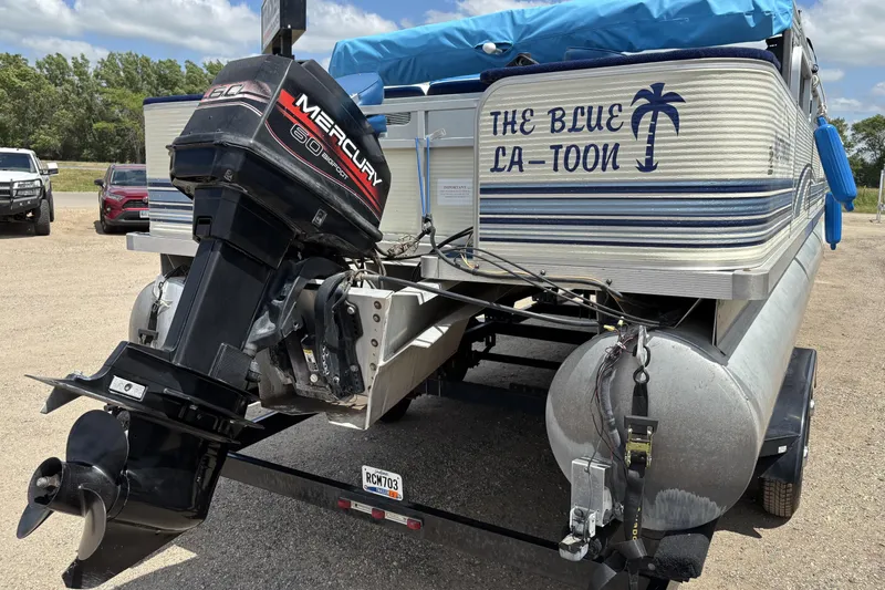 Slide: The Image of 1997 Northwood 24' Pontoon boat with Mercury outboard motor, labeled "The Blue La-Toon." - 5