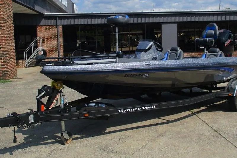 Slide: The Image of 2022 Ranger Z185 boat on trailer, parked outside a building. - 3