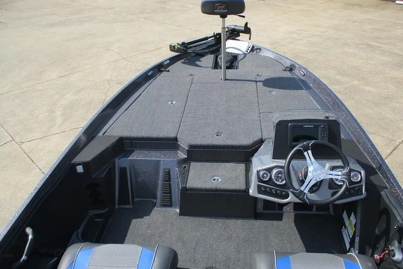 Slide: The Image of 2022 Ranger Z185 boat interior with steering wheel and control panel, featuring spacious deck layout. - 4