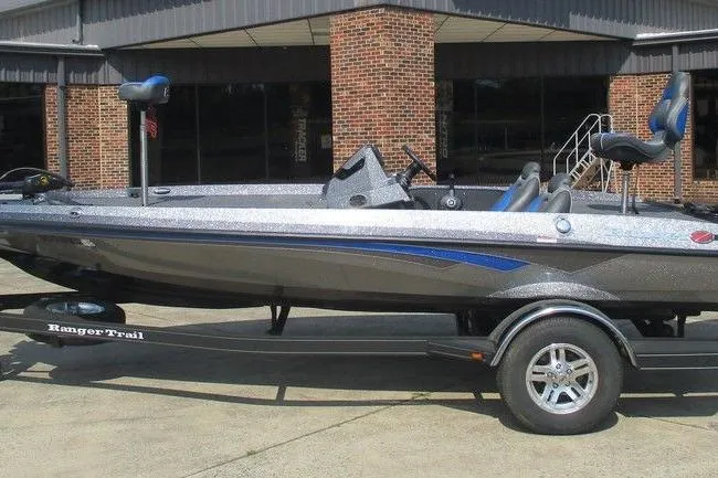 The Image of 2022 Ranger Z185 boat on trailer, parked outside a brick building. - 0