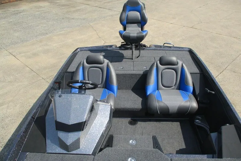Slide: The Image of 2022 Ranger Z185 boat interior with blue and gray seating, steering wheel, and console. - 6