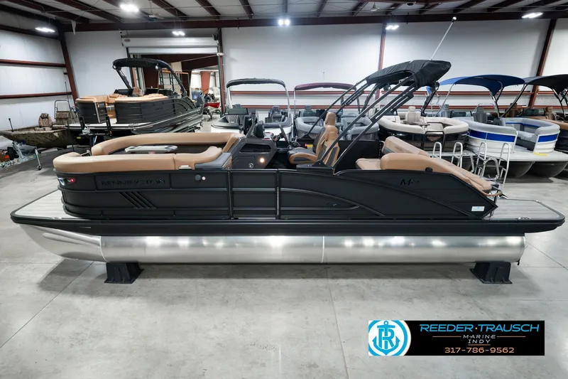 The Image of 2027 Bennington 24 MSB pontoon boat in showroom, featuring sleek design and comfortable seating. - 0