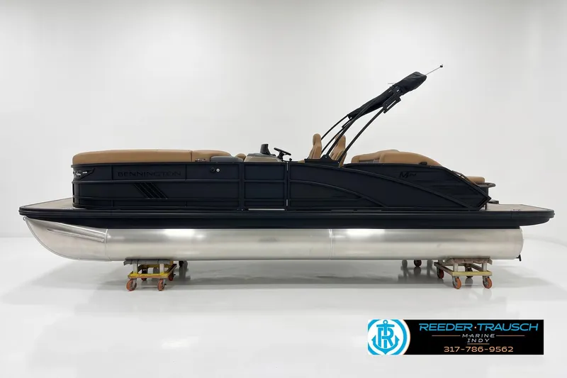 The Image of 2027 Bennington 24 MSB pontoon boat with sleek design and tan seating. - 1