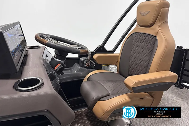 Slide: The Image of Captain's chair and helm of 2027 Bennington 24 MSB pontoon boat, featuring luxury design. - 3