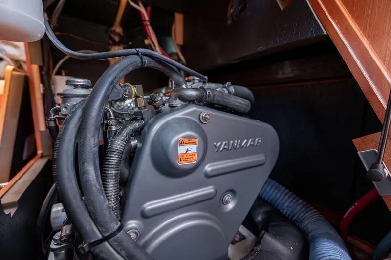 Slide: The Image of Yanmar engine inside a 2013 Beneteau Oceanis 50 sailboat, showcasing mechanical components. - 74