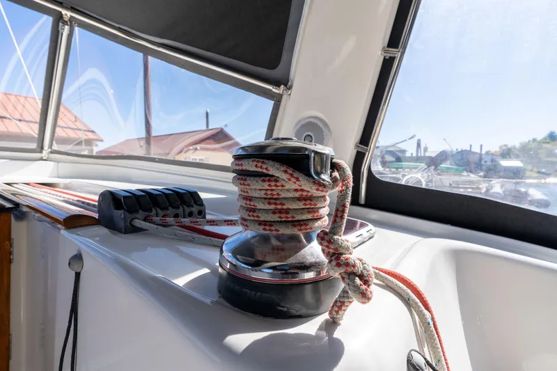Slide: The Image of Winch and ropes on 2013 Beneteau Oceanis 50 sailboat deck, sunny day. - 55