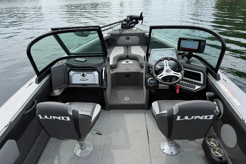 Slide: The Image of Interior of a 2023 Lund 1975 Tyee boat with modern controls and seating. - 9