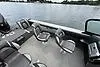 Slide: The Image of 2023 Lund 1975 Tyee boat interior with swivel seats on a calm lake. - 3