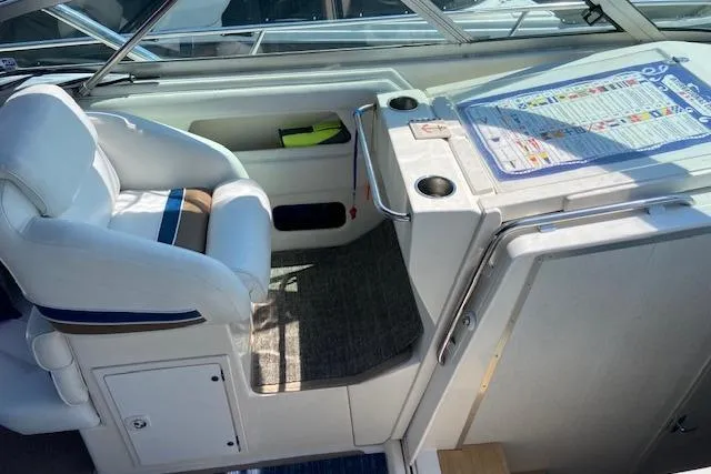 Slide: The Image of 1994 Cruisers Yachts 3675 Esprit cockpit with white seating and control panel. - 4