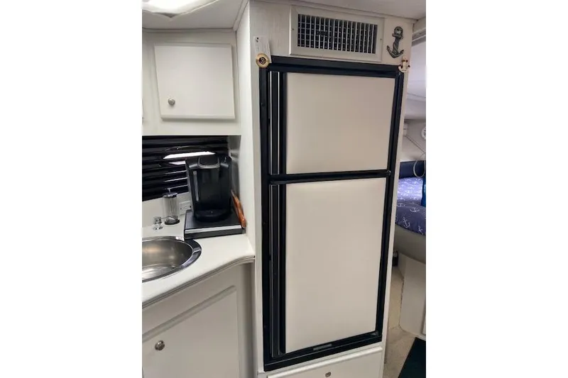 Slide: The Image of 1994 Cruisers Yachts 3675 Esprit interior with kitchenette and refrigerator. - 14