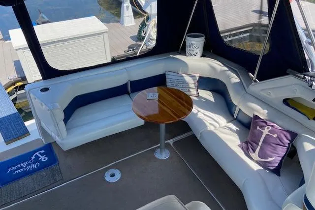Slide: The Image of Luxurious 1994 Cruisers Yachts 3675 Esprit interior with cozy seating and nautical decor. - 6