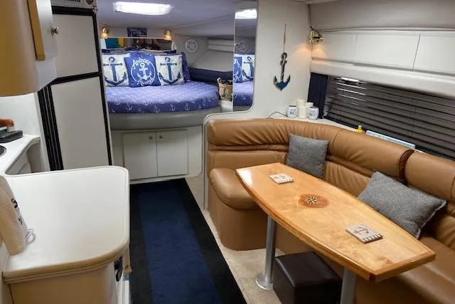 Slide: The Image of Interior of 1994 Cruisers Yachts 3675 Esprit with cozy seating and nautical decor. - 8