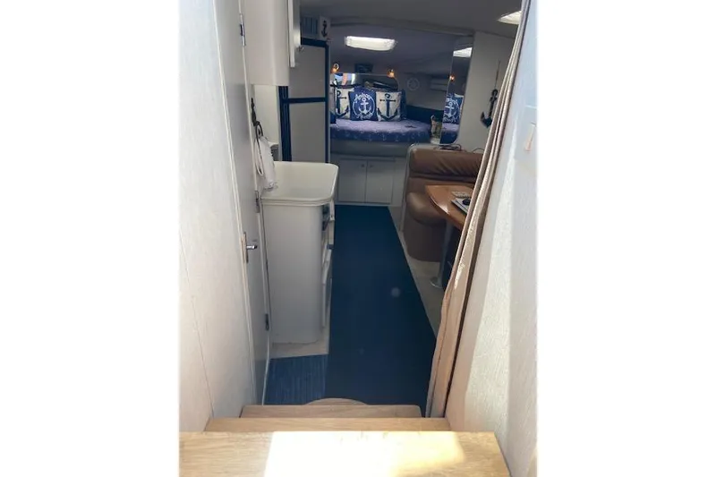 Slide: The Image of Interior view of 1994 Cruisers Yachts 3675 Esprit, featuring cozy cabin and seating area. - 15
