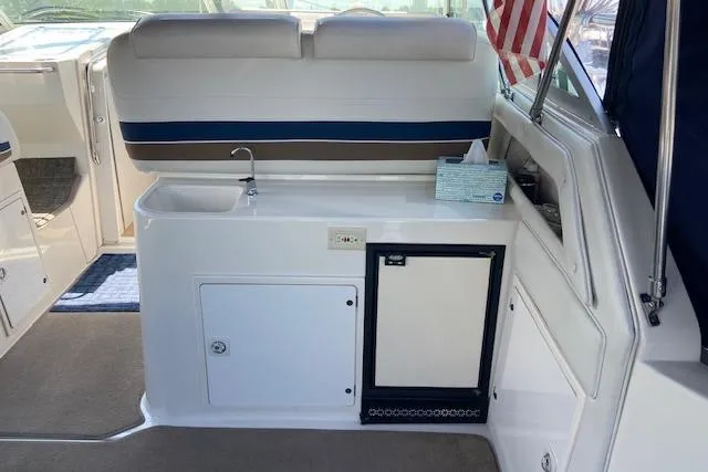 Slide: The Image of 1994 Cruisers Yachts 3675 Esprit interior with kitchenette and seating area. - 7