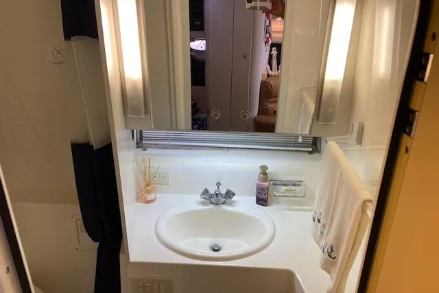 Slide: The Image of Bathroom interior of 1994 Cruisers Yachts 3675 Esprit with sink and mirror. - 16