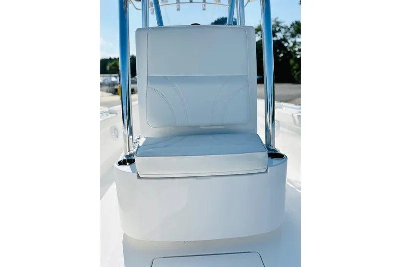 Slide: The Image of 2023 Contender 24 Sport boat seat with sleek white upholstery and stainless steel frame. - 12