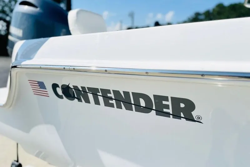 Slide: The Image of 2023 Contender 24 Sport boat with American flag logo, close-up view. - 8