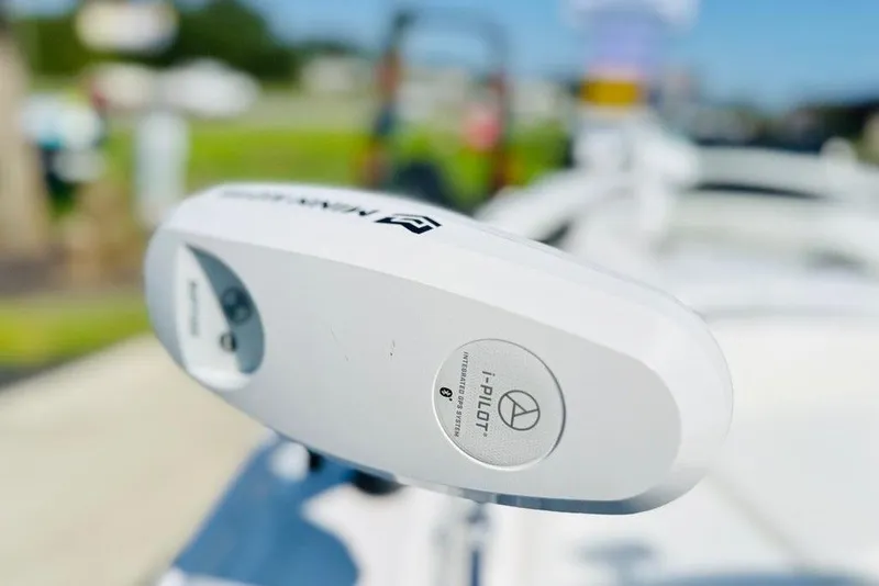 Slide: The Image of Close-up of a 2023 Contender 24 Sport boat's i-Pilot trolling motor. - 4