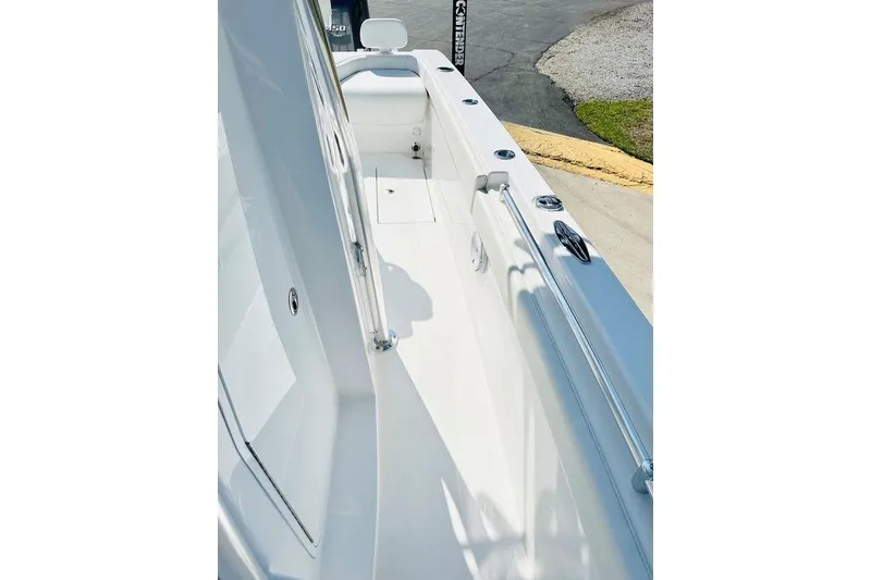 Slide: The Image of 2023 Contender 24 Sport boat deck, showcasing sleek design and modern features. - 9