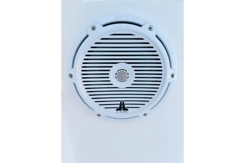 Slide: The Image of White JL Audio speaker on 2023 Contender 24 Sport boat. - 5