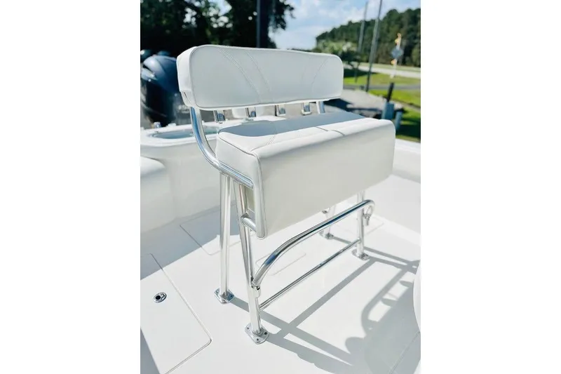 Slide: The Image of 2023 Contender 24 Sport boat seat with sleek white upholstery and chrome accents. - 17