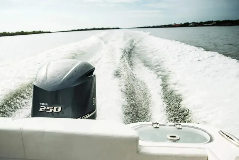 Slide: The Image of Manufacturer Provided Image: 2023 Edgewater 230CX Crossover boat with Yamaha 250 engine cruising on open water. - 9