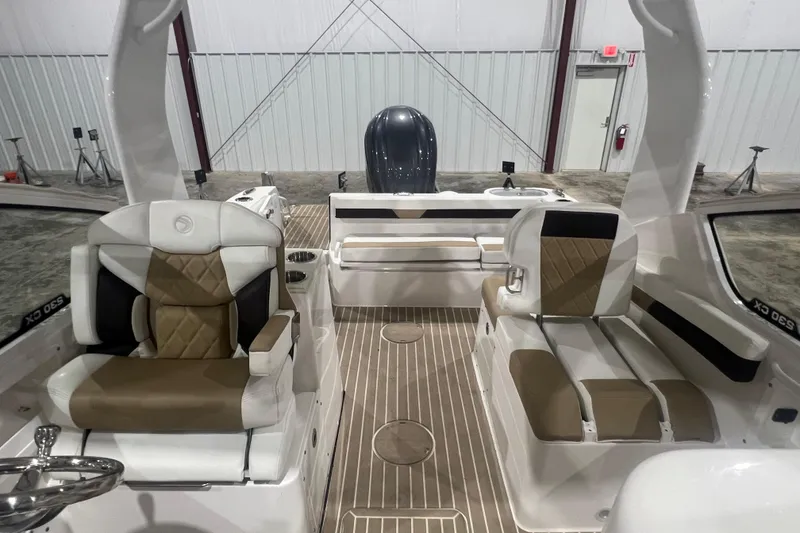 Slide: The Image of 2023 Edgewater 230CX Crossover boat interior with stylish seating and modern design. - 6