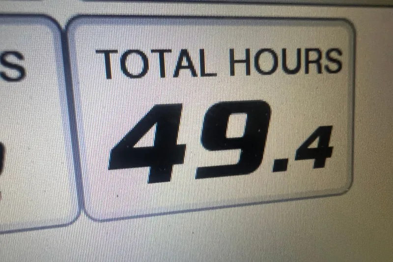 Slide: The Image of Display showing total hours as 49.4 on 2023 Edgewater 230CX Crossover. - 8