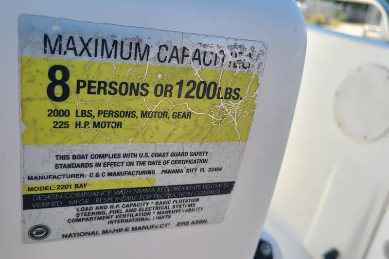 Slide: The Image of Century 2201 Bay Boat 2001 capacity label: 8 persons or 1200 lbs, 225 HP motor. - 14