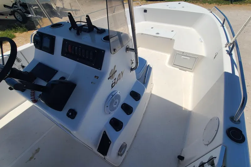 Slide: The Image of 2001 Century 2201 Bay Boat interior with console and seating area. - 8