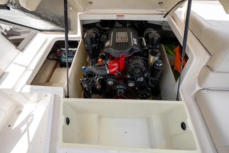Slide: The Image of Engine compartment of a 2008 Regal 2000 Bowrider boat, showcasing the motor and components. - 27