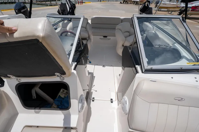 Slide: The Image of 2008 Regal 2000 Bowrider interior with open storage compartment and seating. - 32