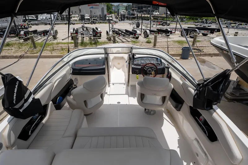 Slide: The Image of Interior view of a 2008 Regal 2000 Bowrider boat with seating and dashboard. - 14