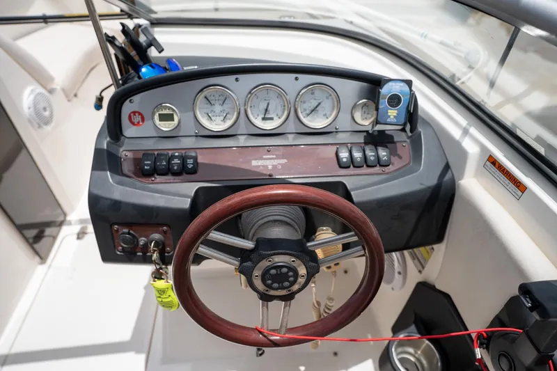 Slide: The Image of 2008 Regal 2000 Bowrider dashboard with gauges and steering wheel. - 22