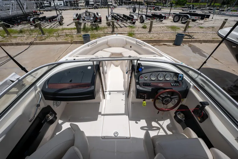 Slide: The Image of 2008 Regal 2000 Bowrider boat interior with steering wheel and dashboard controls. - 16