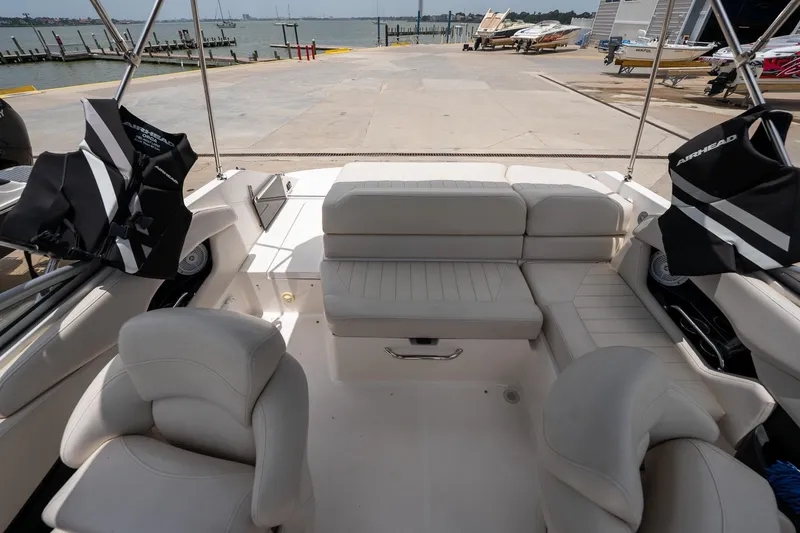 Slide: The Image of Interior of 2008 Regal 2000 Bowrider boat with seating and life jackets, dockside view. - 25