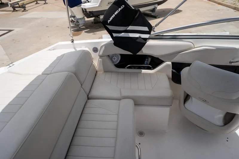 Slide: The Image of Interior of a 2008 Regal 2000 Bowrider boat with beige seating. - 20