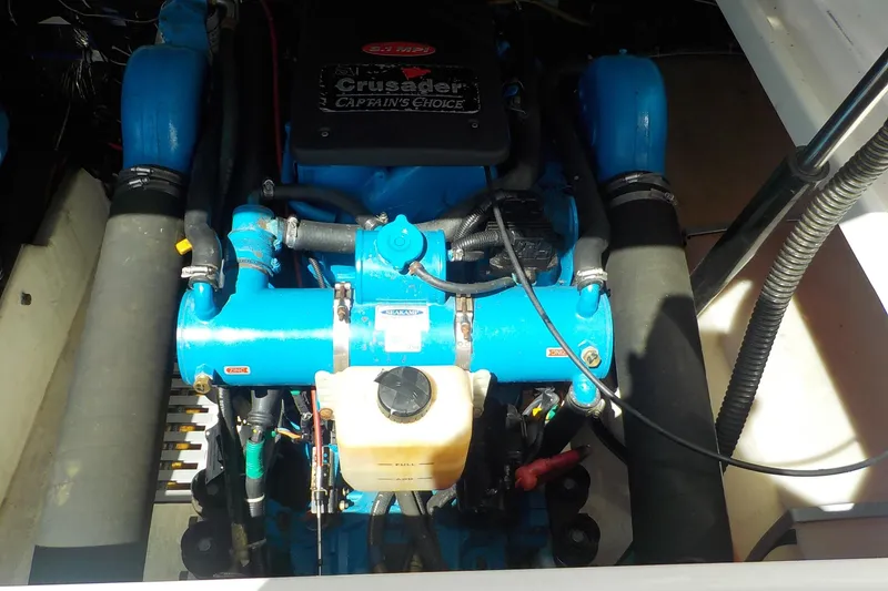 Slide: The Image of Engine compartment of a 2001 Tiara Yachts 3100 Open, featuring a Crusader engine. - 25
