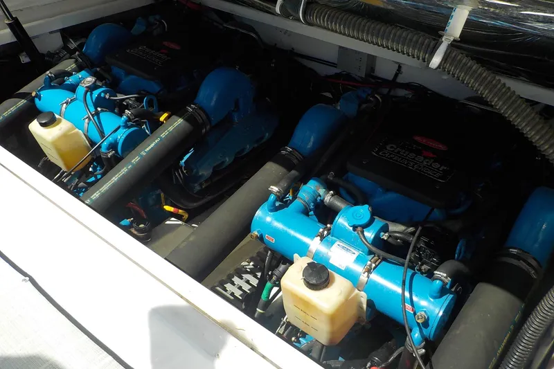 Slide: The Image of Engine compartment of a 2001 Tiara Yachts 3100 Open, featuring dual Crusader engines. - 23