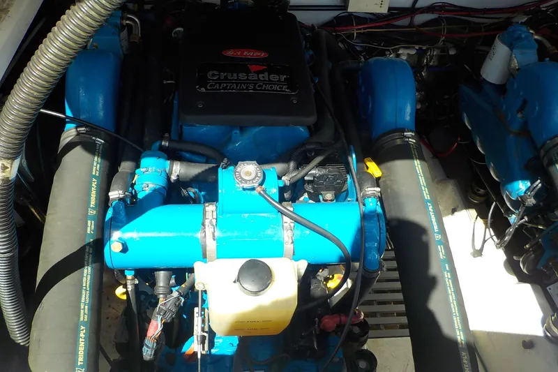 Slide: The Image of Engine compartment of a 2001 Tiara Yachts 3100 Open, featuring a Crusader engine. - 28