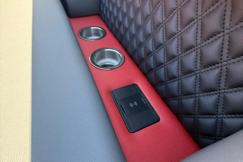 Slide: The Image of Interior of 2026 Berkshire 23RFX STS with cup holders and wireless charging pad. - 15