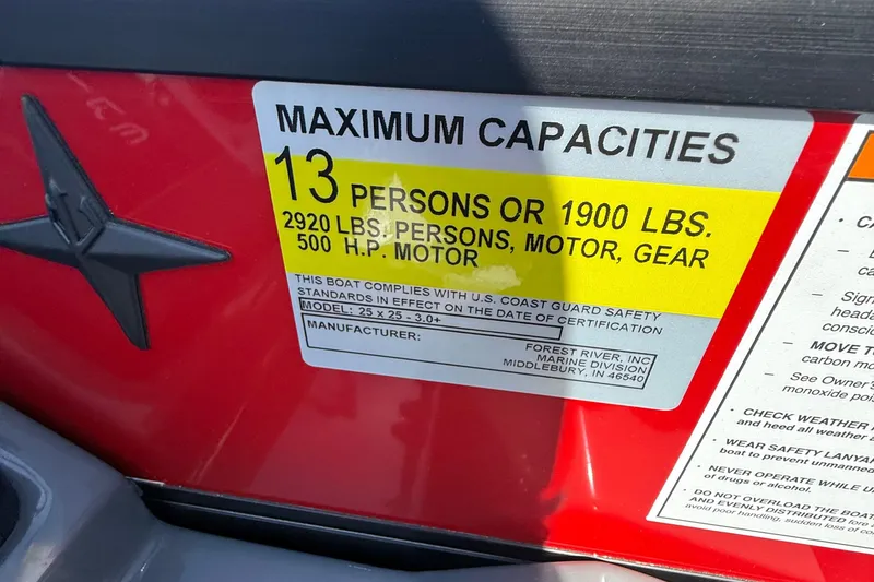 Slide: The Image of 2026 Berkshire 23RFX STS capacity label: 13 persons, 1900 lbs, 2920 lbs with gear, 500 HP motor. - 16