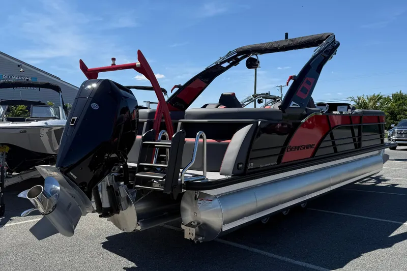 Slide: The Image of 2026 Berkshire 23RFX STS pontoon boat with sleek design and powerful outboard motor. - 8