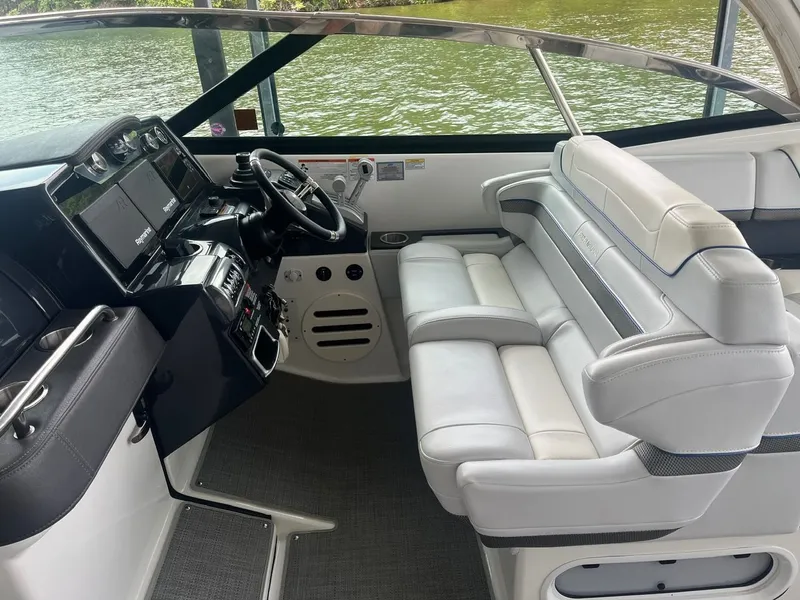 Slide: The Image of The cockpit of a 2019 Formula 350 Crossover Bowrider with white leather seats and modern instruments. - 16