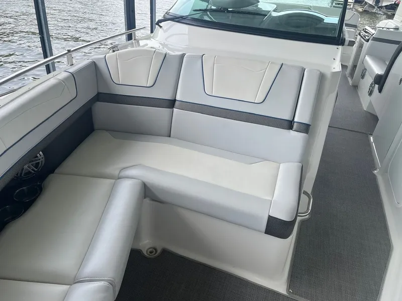 Slide: The Image of Interior view of a luxury boat with gray and white upholstery. - 13